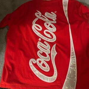 NWT Coca Cola t shirt. Queen of Sparkles brand  Size LG. Never worn to small